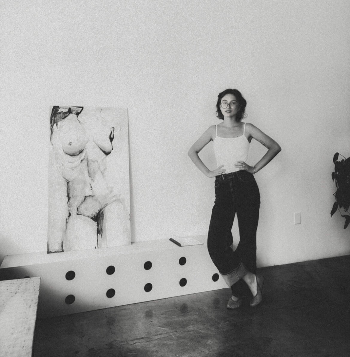 Julia Maria Zych at Los Angeles Art Exhibition Julia Maria Zych standing with her painting at an art exhibition in Los Angeles